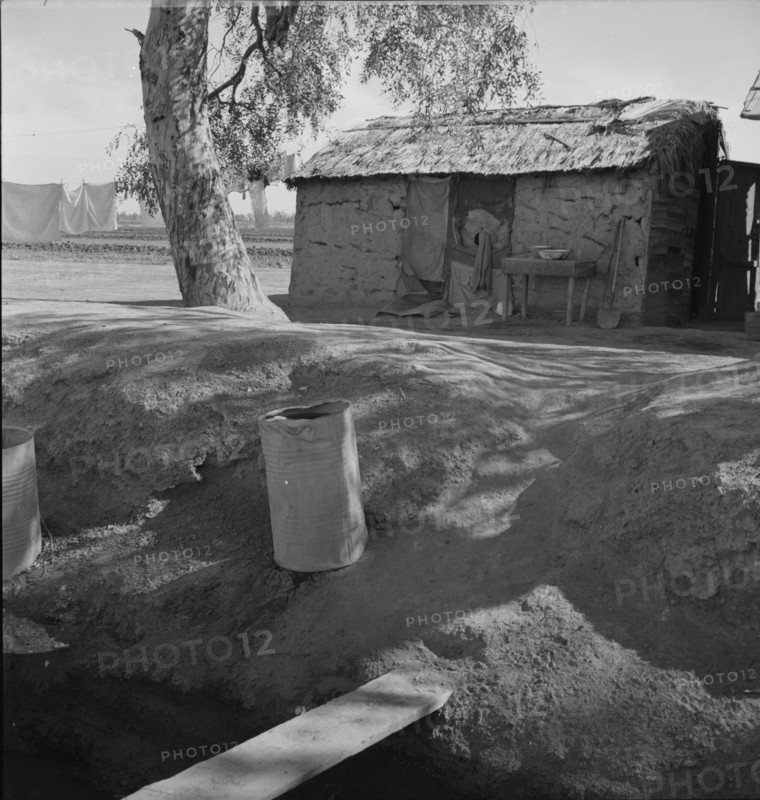 Ditch bank housing for Mexican field workers, Imperial Valley, California, 1937. Creator: Dorothea Lange.