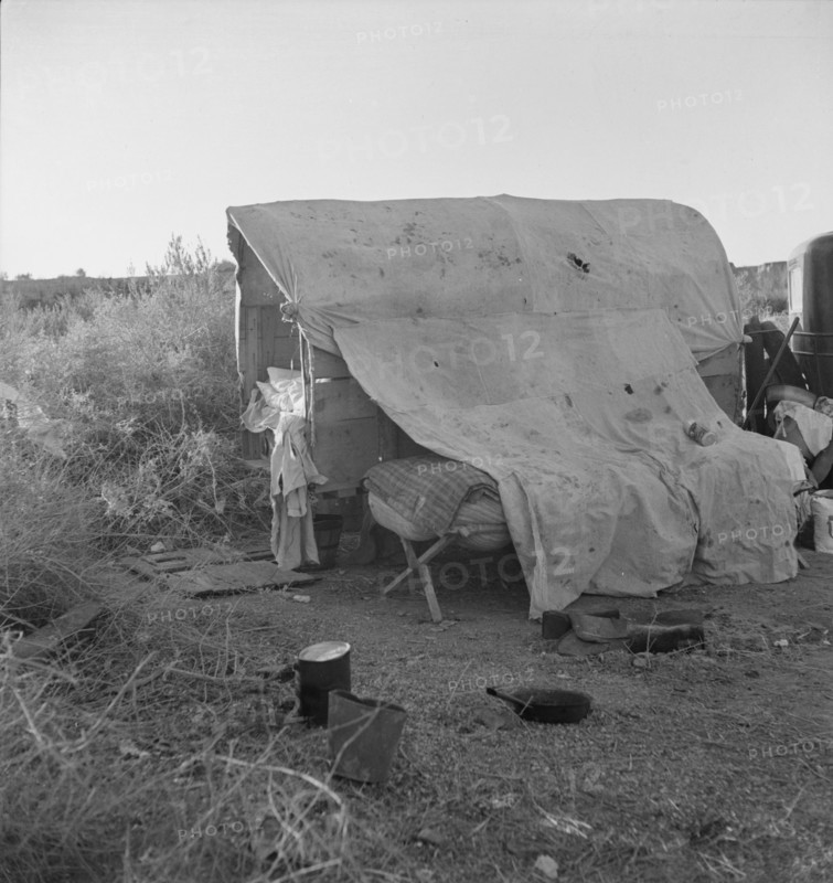 Oklahomans encamped on a river bottom near Holtville, California, 1937. Creator: Dorothea Lange.