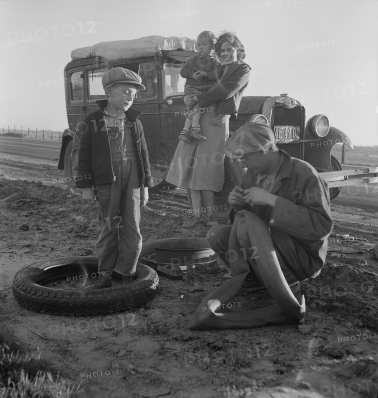 Migratory agricultural worker family along California highway. U.S. 99. 1937. Creator: Dorothea Lange.