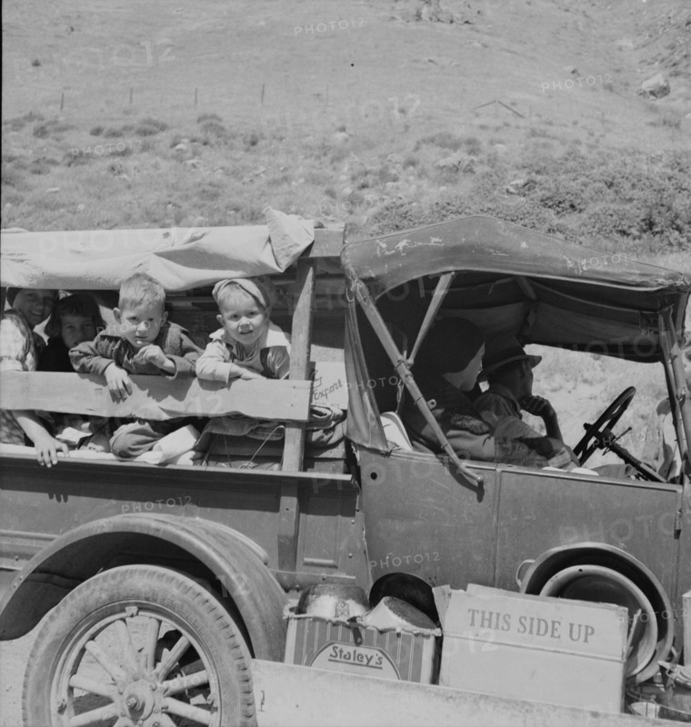 Family of drought refugees on US 99 near Bakersfield, California, 1937. Creator: Dorothea Lange.