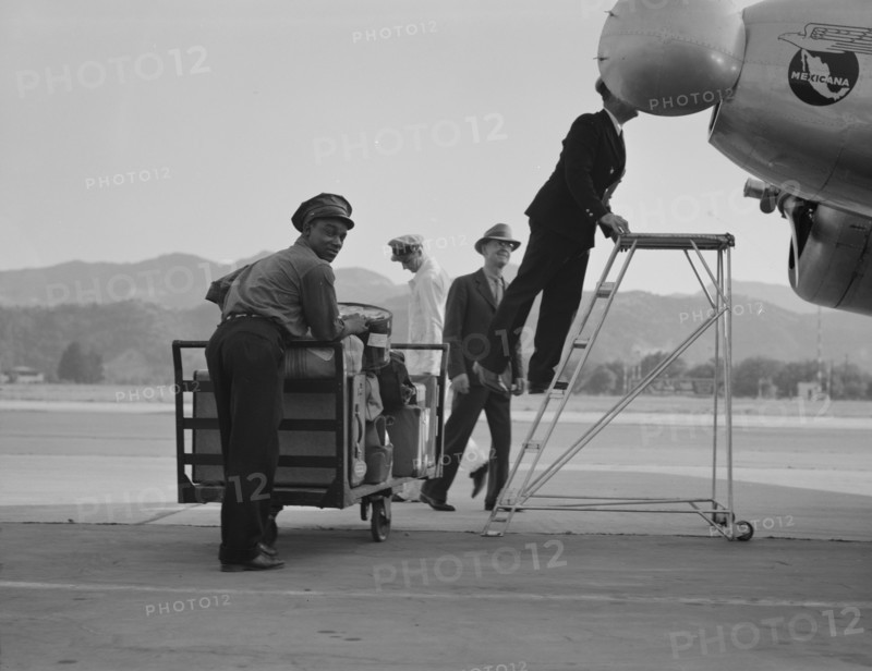 Department of Agriculture plant quarantine inspectors, Glendale Airport, California, 1937. Creator: Dorothea Lange.