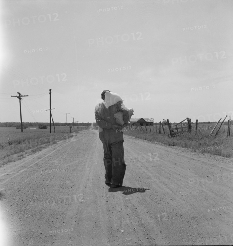 Man going home with relief, near Oil City, Carter County, Oklahoma, 1937. Creator: Dorothea Lange.