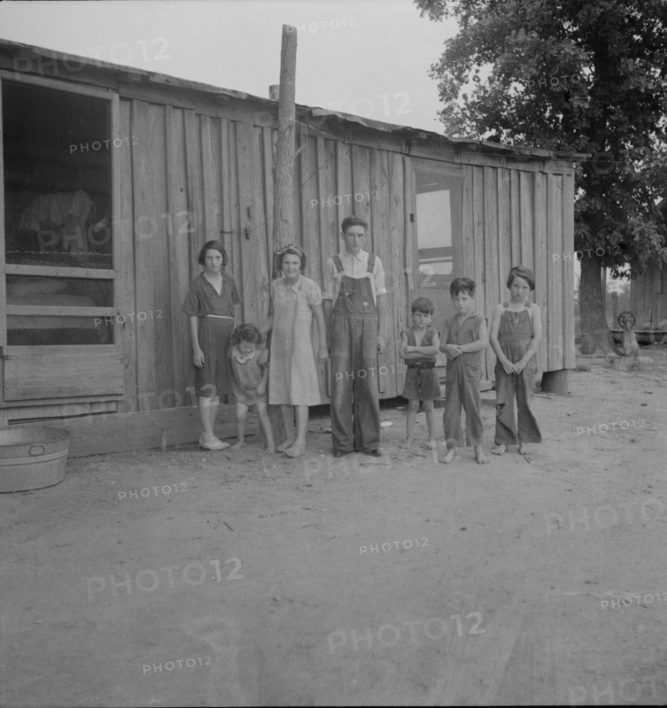 Part of a family of ten children who live and farm in the area, Arkansas, 1937. Creator: Dorothea Lange.