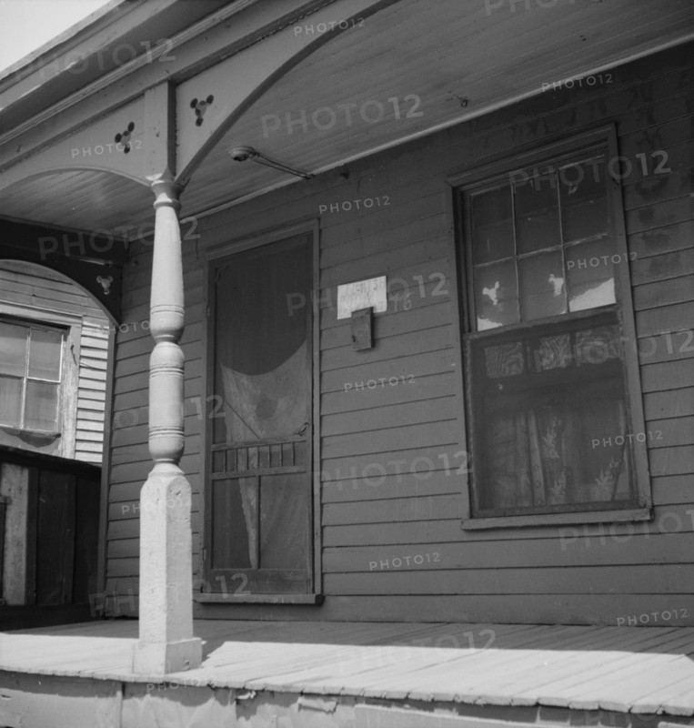 Furnish room in the Negro quarter from which cotton hoers are recruited, Memphis, Tennessee, 1937. Creator: Dorothea Lange.