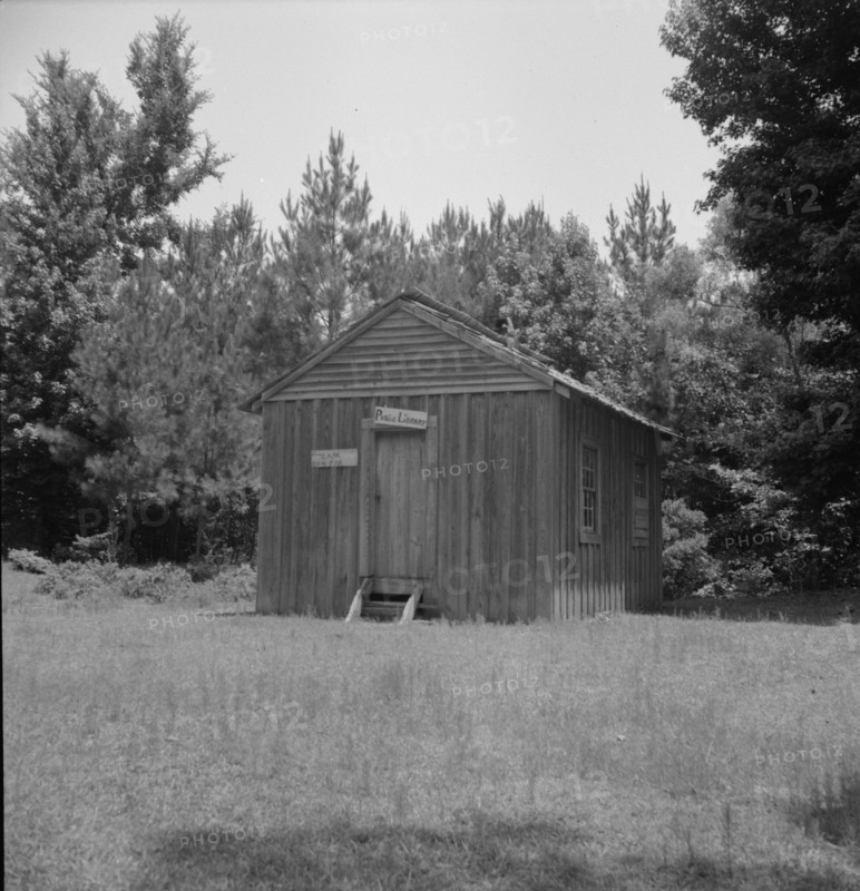 Public library in the southwestern section of Mississippi, in the piney woods, 1937. Creator: Dorothea Lange.