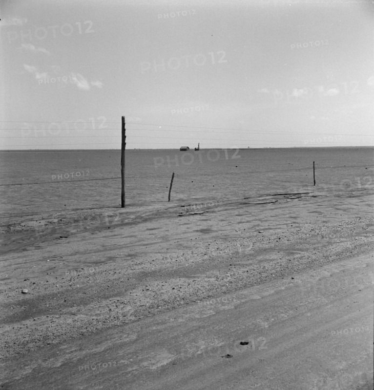 Abandoned farm on the high plains, Texas County, Oklahoma, 1938. Creator: Dorothea Lange.