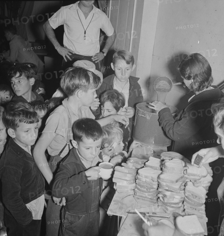The children at Halloween party in Shafter migrant cooperative, California, 1938. Creator: Dorothea Lange.