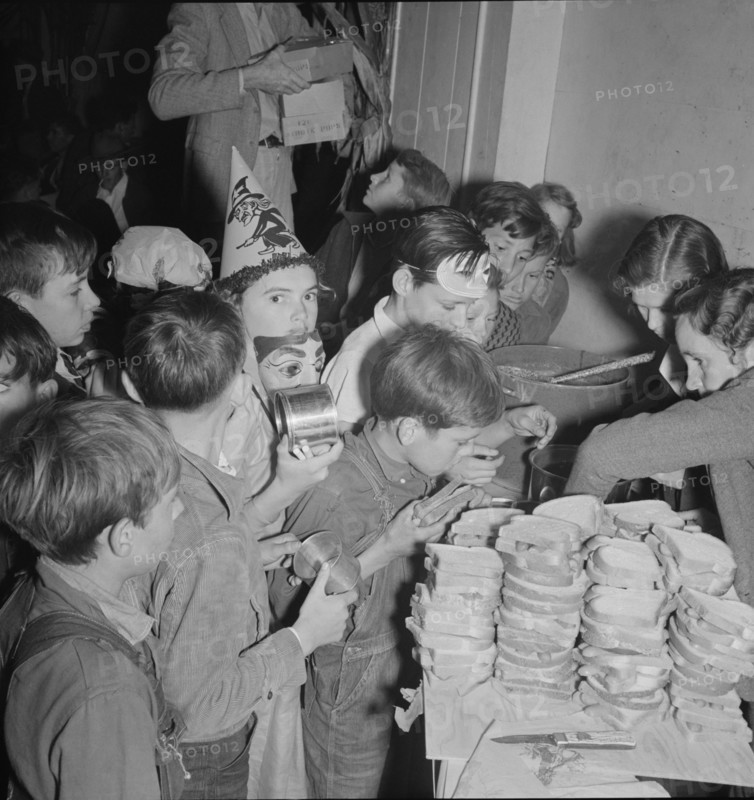 The children at Halloween party in Shafter migrant camp, California, 1938. Creator: Dorothea Lange.