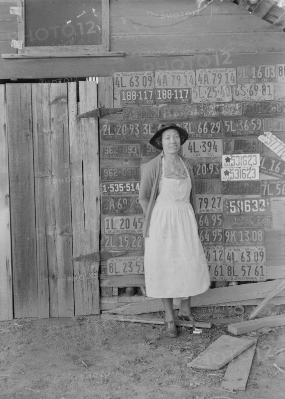 Farm woman beside her barn door,  Tulare County, California, 1938. Creator: Dorothea Lange.