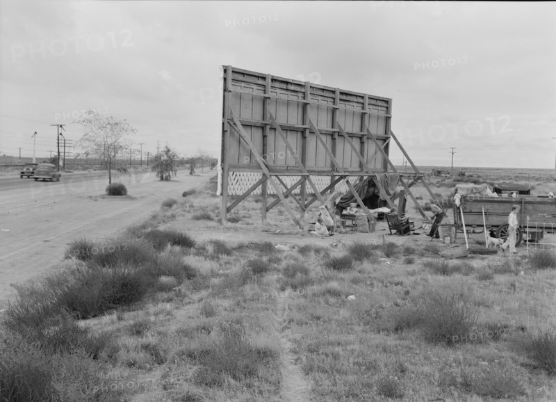 Three families camped on the plains along US 99 in California, 1938. Creator: Dorothea Lange.