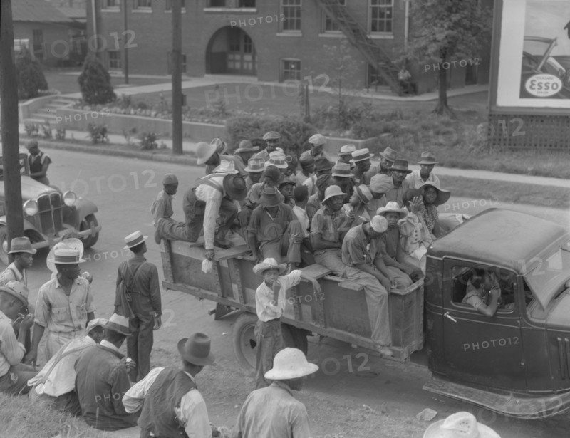 Cotton hoers are transported to the fields daily during the season, Memphis, Tennessee, 1937. Creator: Dorothea Lange.