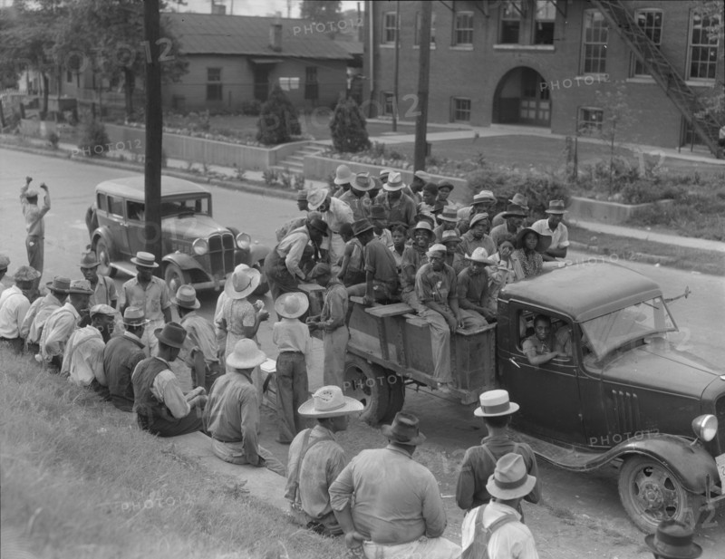 Cotton hoers loading at Memphis, Tennessee for the day's work in Arkansas, 1937. Creator: Dorothea Lange.