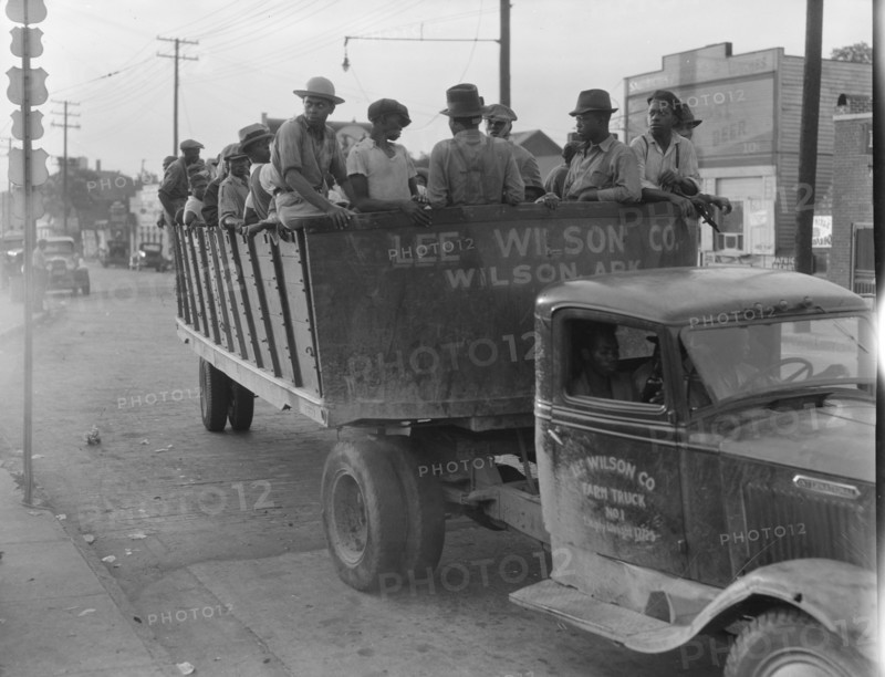 Cotton hoers from Memphis bound for the Wilson Plantation in Arkansas, forty-three miles away, 1937. Creator: Dorothea Lange.