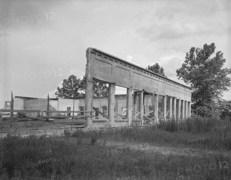 Remains of storefronts in Fullerton, Louisiana, an abandoned lumber town, 1937. Creator: Dorothea Lange.