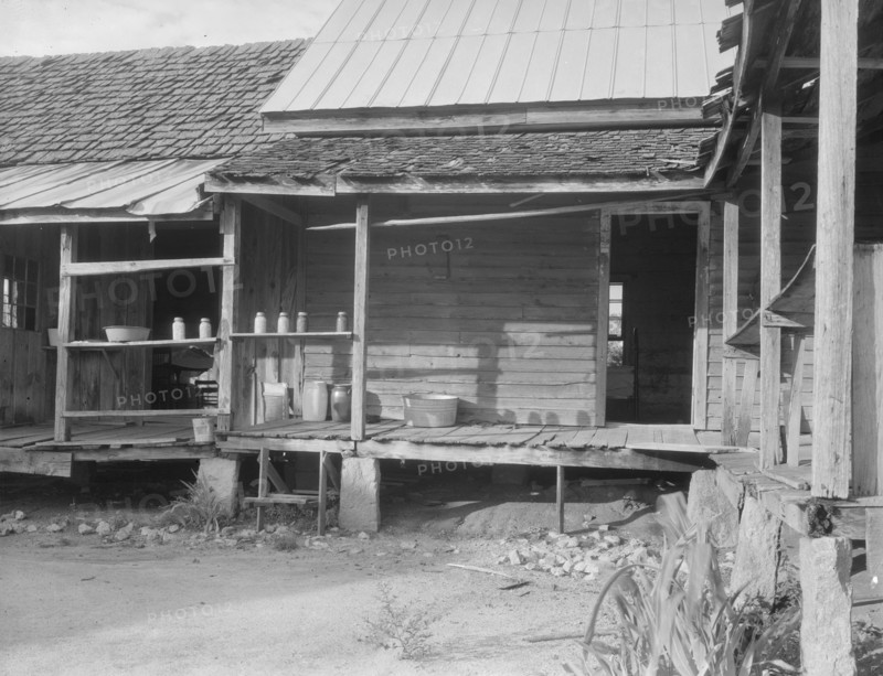 House in which cotton farmer has lived for fifty years, Macon County, Georgia, 1937. Creator: Dorothea Lange.