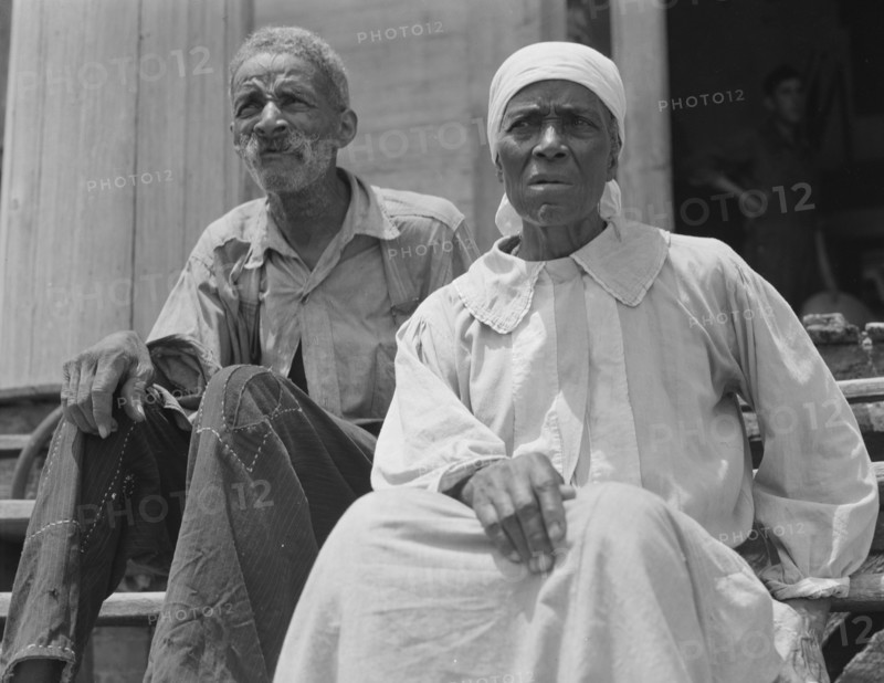 Ex-slave and wife who live in a decaying plantation house, Greene County, Georgia, 1937. Creator: Dorothea Lange.
