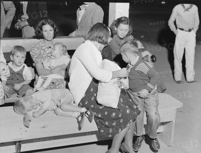At the end of the Halloween party at Shafter migrant camp, California, 1938. Creator: Dorothea Lange.