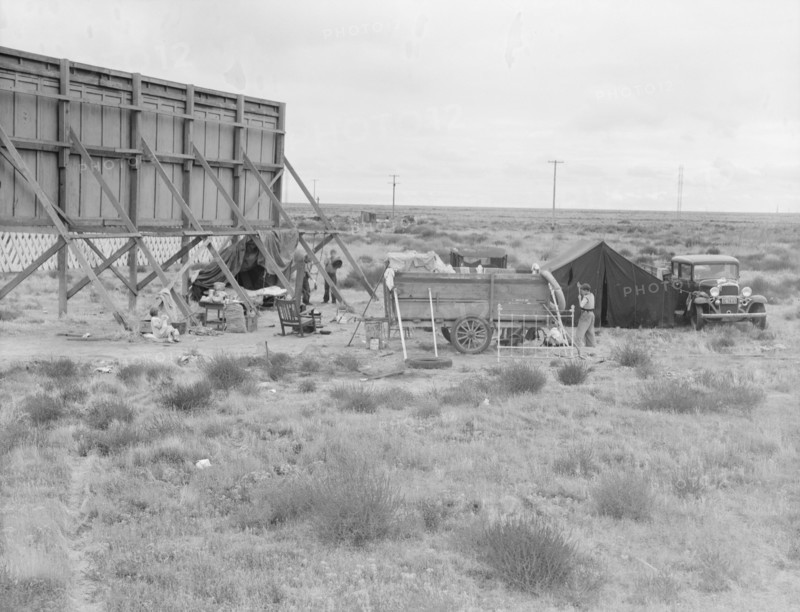 Billboard along U.S. 99...three destitute families...Kern County, CA, 1938. Creator: Dorothea Lange.