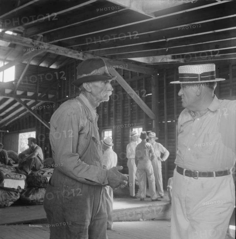 Each farmer follows his tobacco in the warehouse to learn what price..., Douglas, Georgia, 1938. Creator: Dorothea Lange.