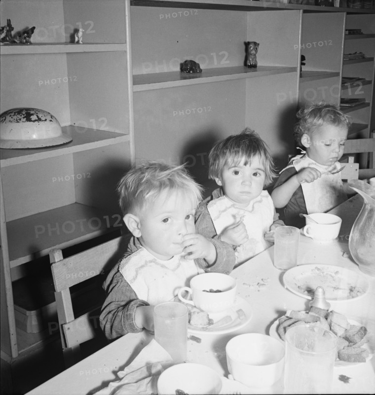 Lunchtime for young migrants at Shafter Camp, California, 1939. Creator: Dorothea Lange.