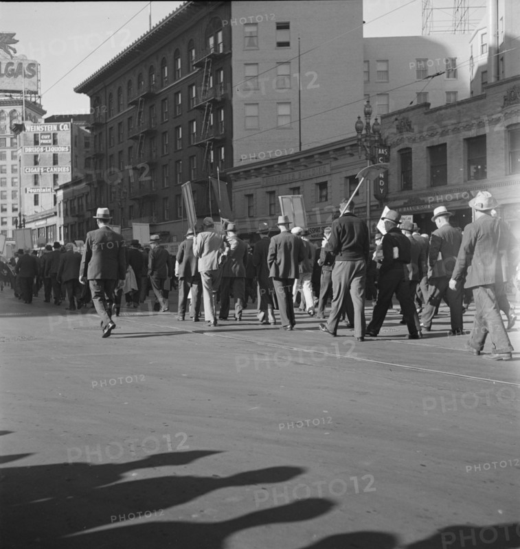 Mass meeting of WPA workers parading up Market Street, San Francisco, California , 1939. Creator: Dorothea Lange.