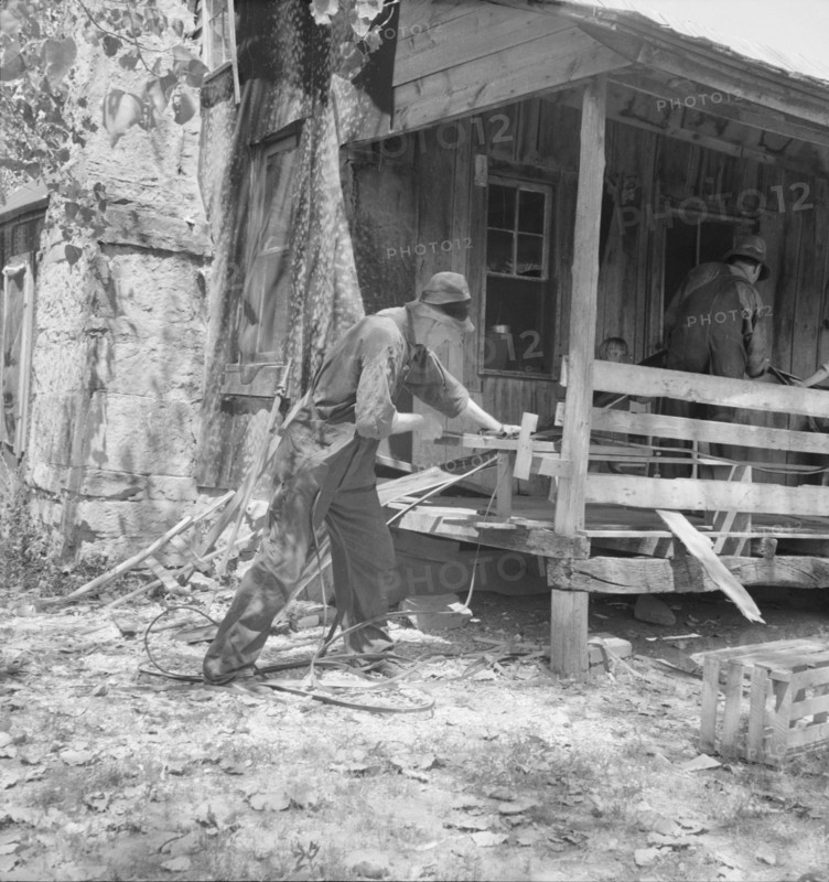 In Arkansas Hills (Ozarks) near Seligman, Missouri, splitting hickory for chair-bottoms, 1938. Creator: Dorothea Lange.