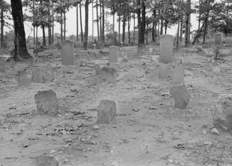 A red clay Negro cemetery, Bethel Hill High School, Person County, North Carolina, 1939. Creator: Dorothea Lange.