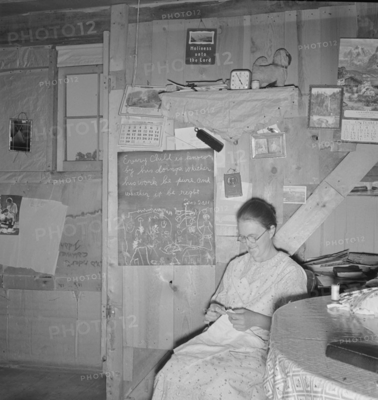 Mrs. Hull in one-room dugout basement home, Dead Ox Flat, Malheur County, Oregon, 1939. Creator: Dorothea Lange.