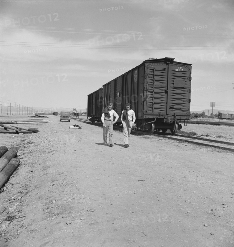 Car on siding across tracks from pea packing plant, Calipatria, Imperial Valley, 1939. Creator: Dorothea Lange.