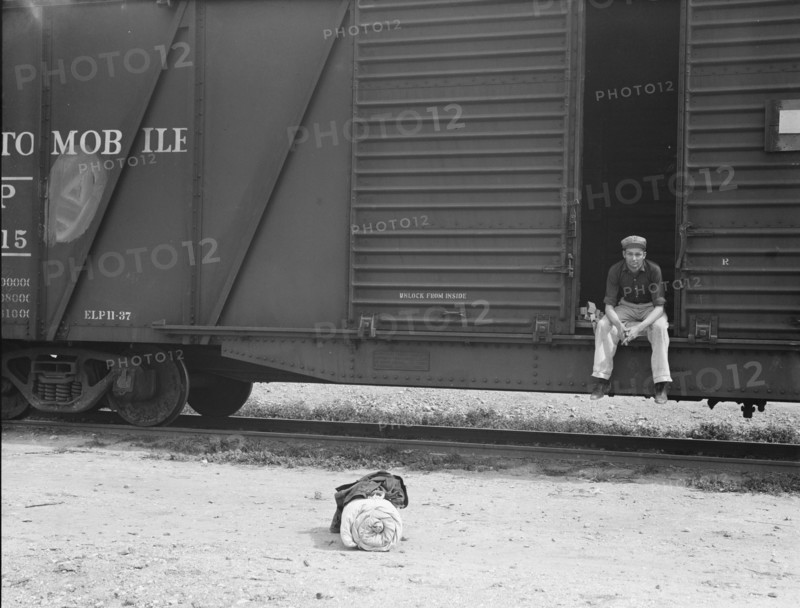 Car on siding across tracks from pea packing plant, Calipatria, Imperial Valley, 1939. Creator: Dorothea Lange.