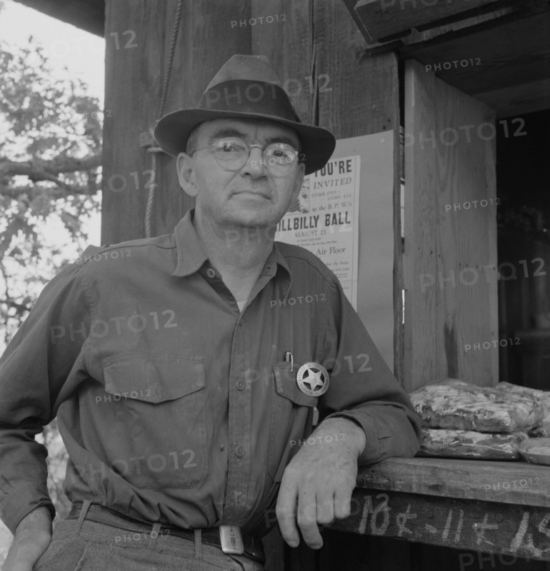 Deputy sheriff, stationed at paymaster's window..., near Grants Pass, Josephine County, Oregon, 1939 Creator: Dorothea Lange.