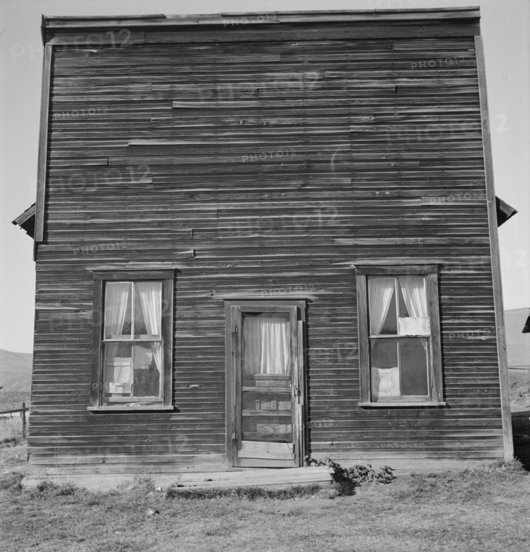 Member of Ola self help sawmill co-op..., "Jacknife Saloon", Gem County, Idaho, 1939. Creator: Dorothea Lange.