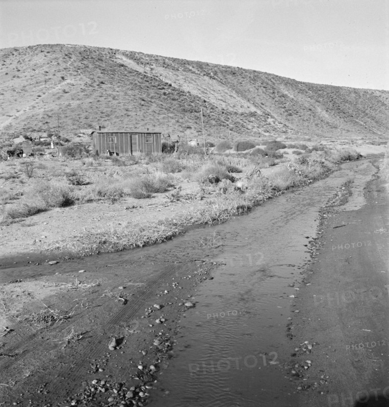 Below the bench, showing condition of road which..., Dead Ox Flat, Malheur County, Oregon, 1939. Creator: Dorothea Lange.