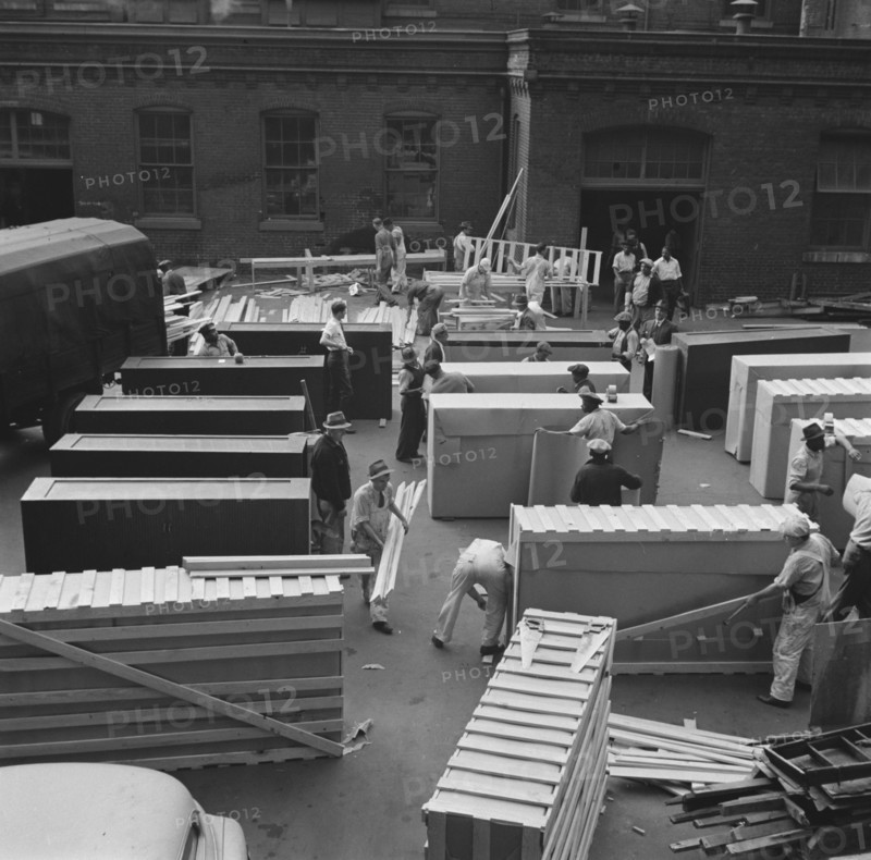 Possibly: United States government workers and carpenters making crates..., Washington, D.C., 1942. Creator: Gordon Parks.