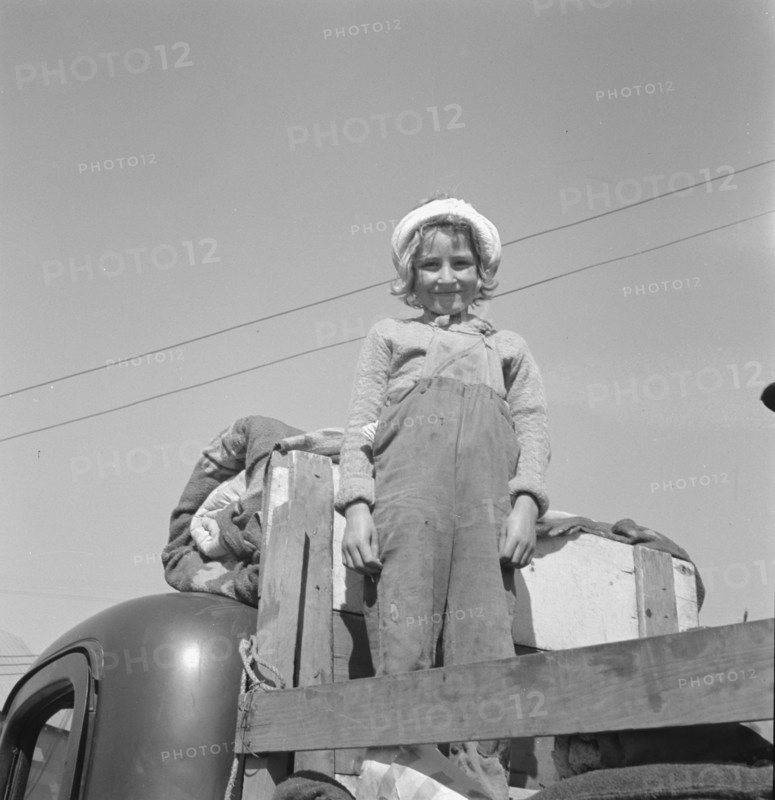 Part of family come for work in potatoes, Tulelake, Siskiyou County, California, 1939. Creator: Dorothea Lange.