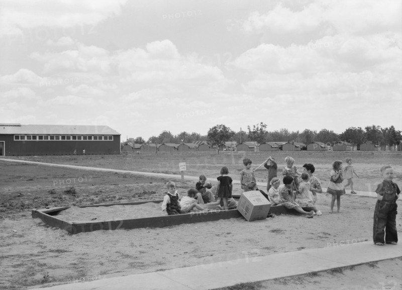 Nursery school children with their teacher, FSA camp, Tulare County, California, 1939. Creator: Dorothea Lange.