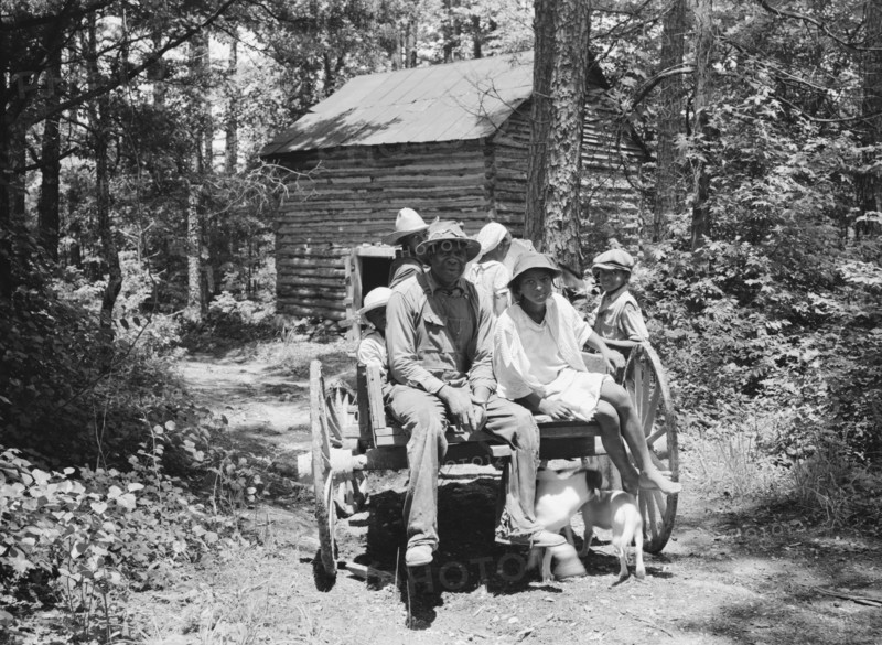 Possibly: Colored sharecropper and his children about to leave..., Shoofly, North Carolina, 1939. Creator: Dorothea Lange.