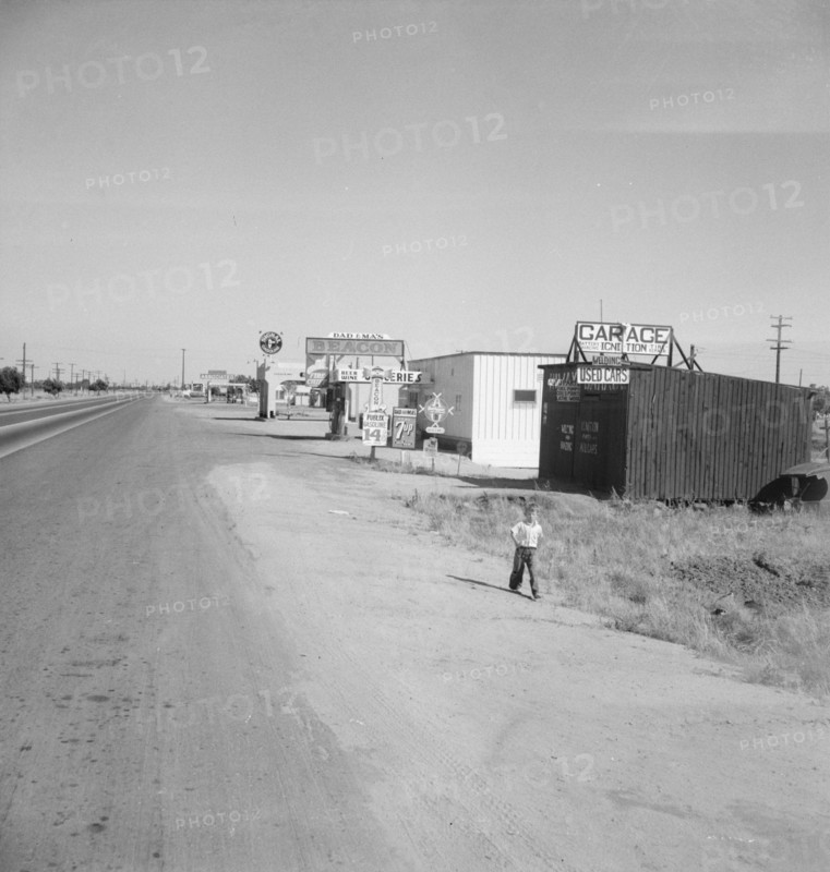 Along the highway U.S. 99 at Highway City, between Tulare and Fresno, California, 1939. Creator: Dorothea Lange.