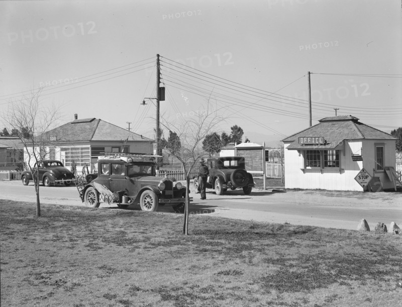 Entering FSA camp for migratory laborers at Indio, Coachella Valley, CA, 1939. Creator: Dorothea Lange.