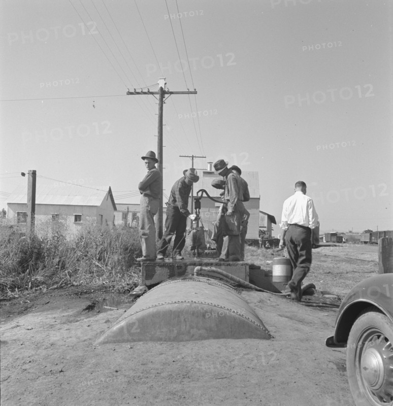 Town pump of Tulelake at railroad yard, Tulelake, Siskiyou County, California, 1939. Creator: Dorothea Lange.