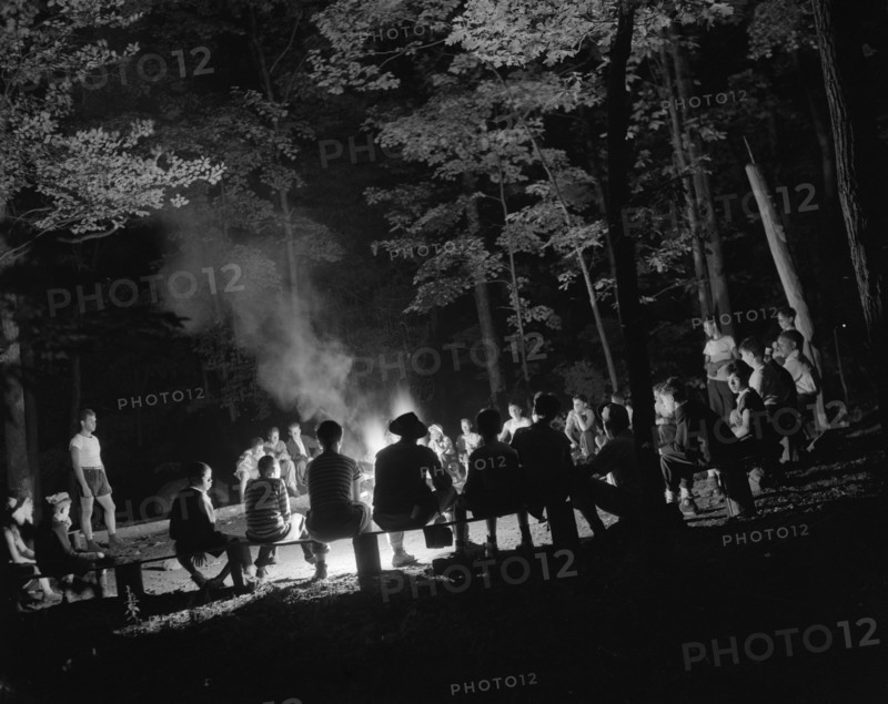 Singing around the camp fire at Camp Nathan Hale, Southfields, New York, 1943 Creator: Gordon Parks.