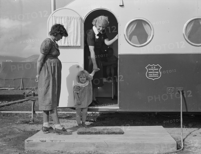 Young mother brings her child to the trailer clinic..., FSA, Merrill, Klamath County, Oregon, 1939. Creator: Dorothea Lange.