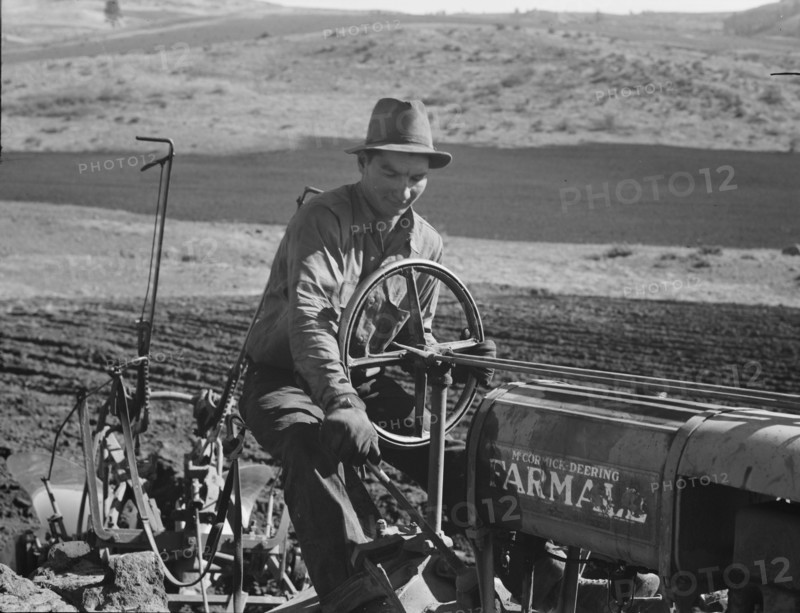 Young Idaho farmer plowing...Ola self-help sawmill co-op..., Gem County, Idaho, 1939. Creator: Dorothea Lange.