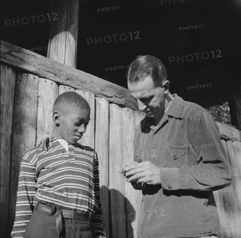 Mr. Lewis Traver, the director, with camper at Camp Nathan Hale, Southfields, New York, 1943 Creator: Gordon Parks.