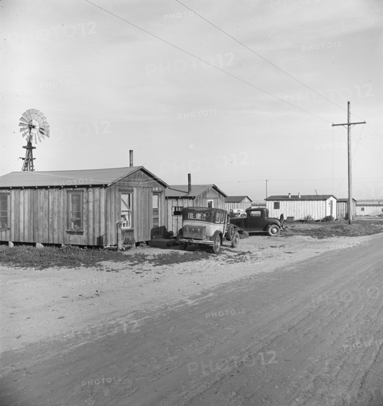 Rented cabins, ten dollars a month...Arkansawyers auto camp, Greenfield, Salinas Valley, CA, 1939. Creator: Dorothea Lange.