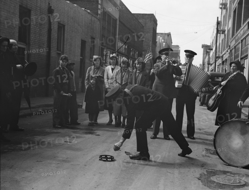 Army contributes first to the tambourine..., Salvation Army, San Francisco, California, 1939. Creator: Dorothea Lange.