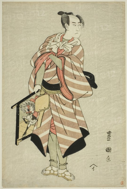 The actor Sawamura Sojuro III as the packhorse-man Muchizo in the play "Miyamairi Musub..., c. 1797. Creator: Utagawa Toyokuni I.