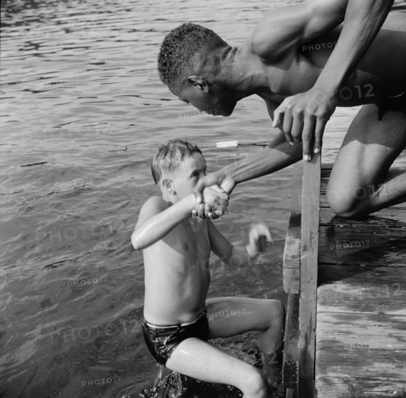 A scene at the swimming dock, Camp Nathan Hale, Southfields, New York, 1943 Creator: Gordon Parks.