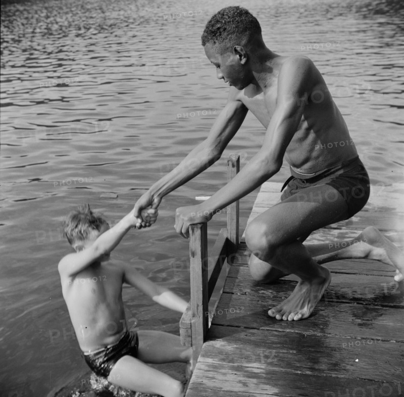 A scene at the swimming dock, Camp Nathan Hale, Southfields, New York, 1943 Creator: Gordon Parks.