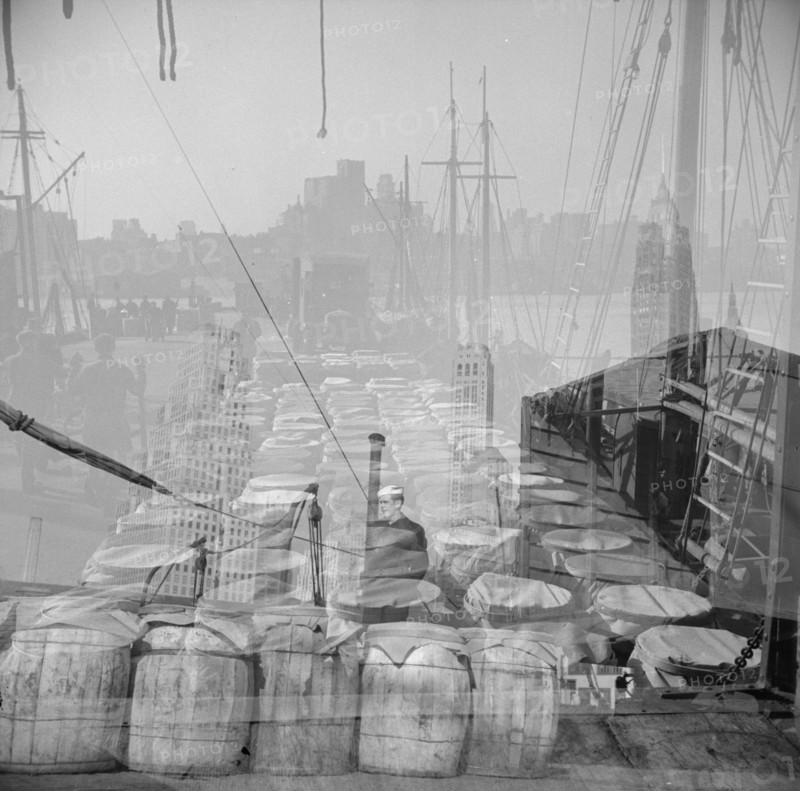 Possibly: Barrels of fish on the docks at the Fulton fish market ready to be..., New York, 1943. Creator: Gordon Parks.